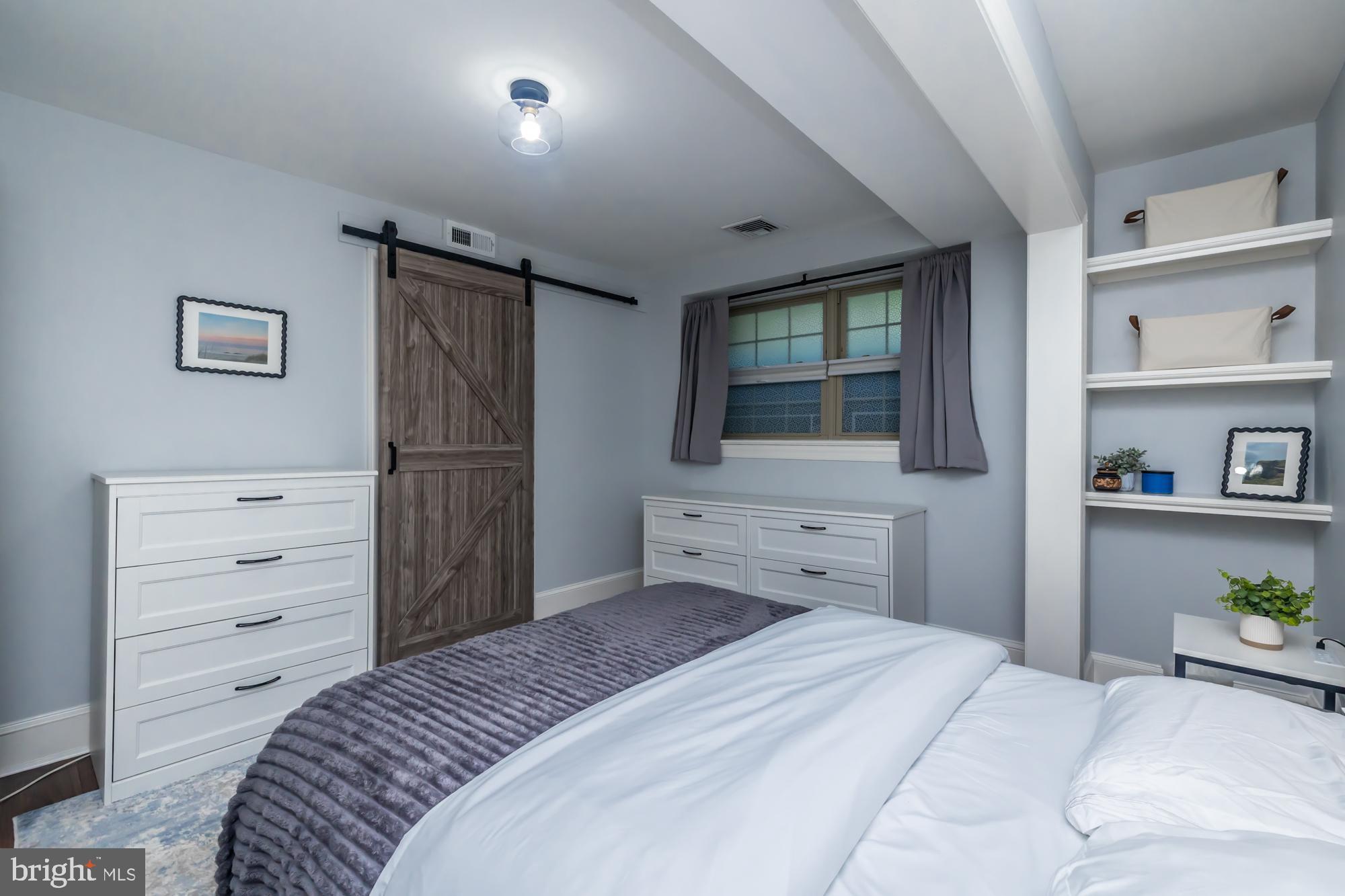 212 Idris Road, Unit Z1 Merion Station, PA 19066 - Photo 28 of 35 a bedroom with a bed and a dresser