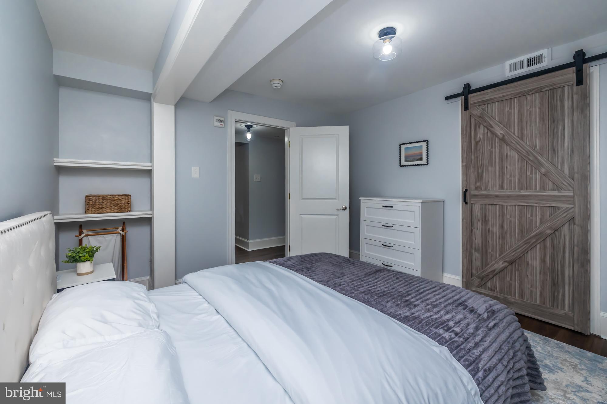 212 Idris Road, Unit Z1 Merion Station, PA 19066 - Photo 30 of 35 a bedroom with a large bed and a closet