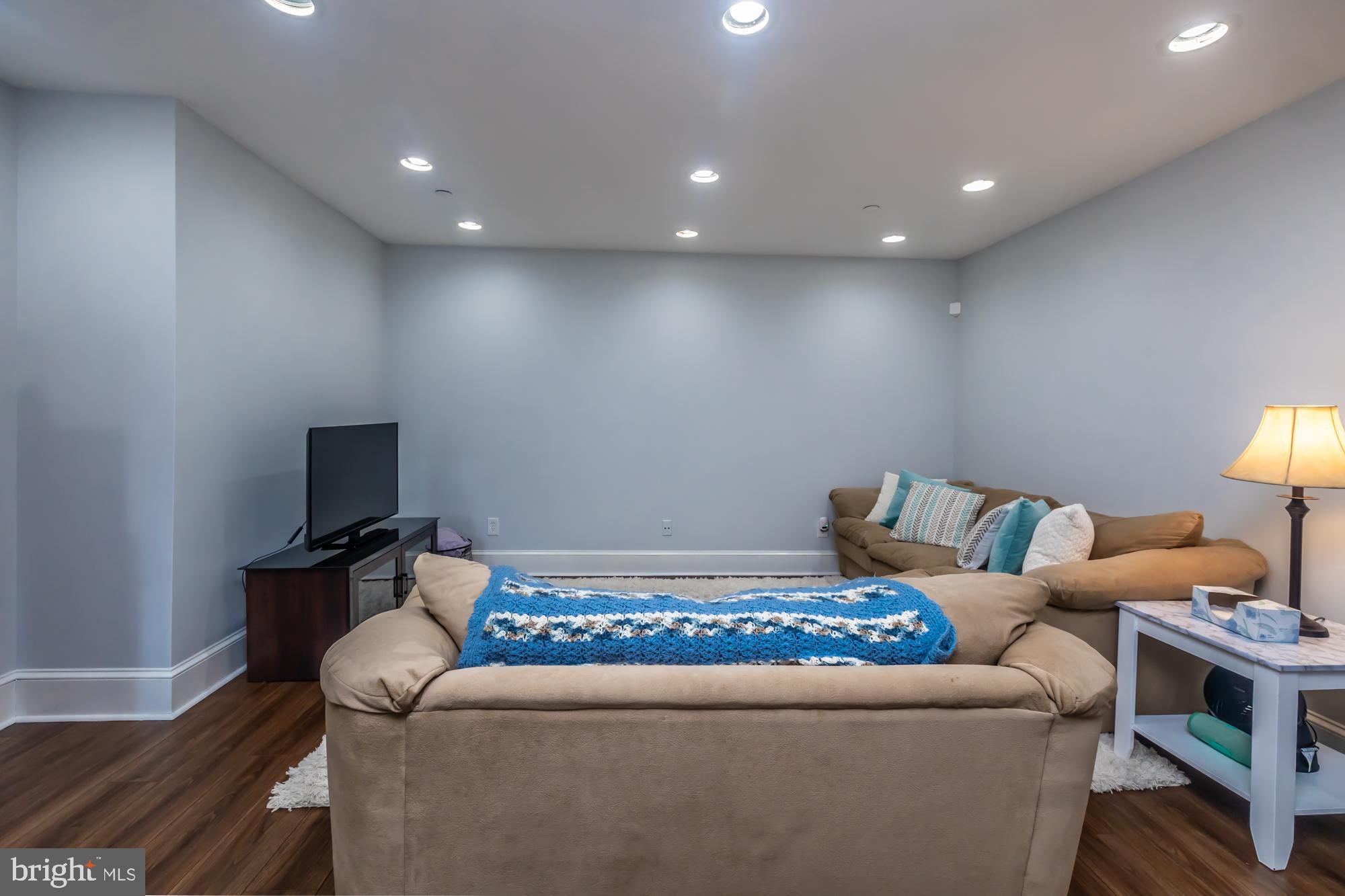 212 Idris Road, Unit Z1 Merion Station, PA 19066 - Photo 10 of 35 a living room with furniture and a flat screen tv