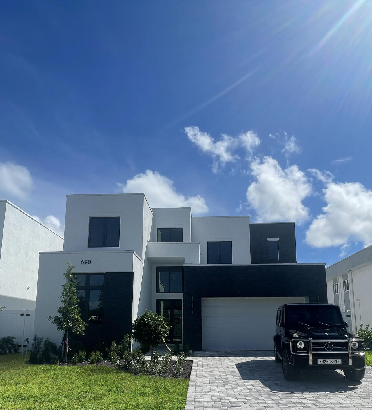 690 Jeffery Street Boca Raton, FL 33487 - Photo 8 of 8 a car parked in front of house with yard