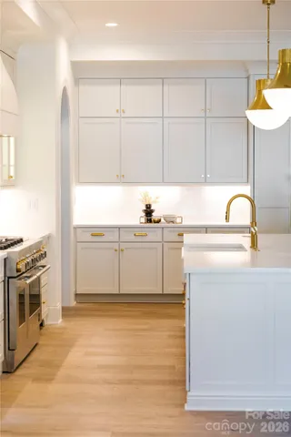 a spacious bathroom with double vanity a mirror a vanity and a bathtub