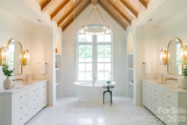 a view of a bathroom with bathtub