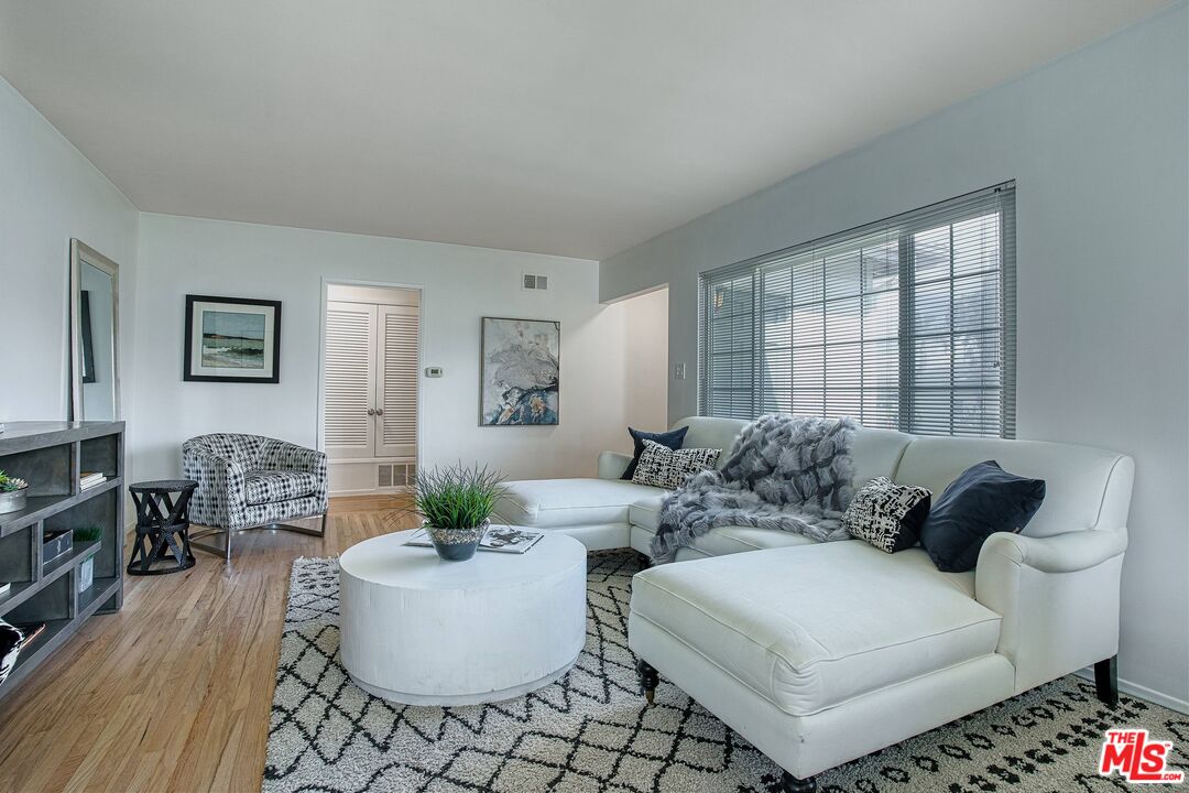 a living room with furniture and a couch