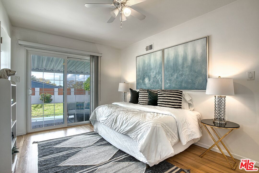 95 Kenneth Street Camarillo, CA 93010 - Photo 11 of 25 a bedroom with a bed and a lamp