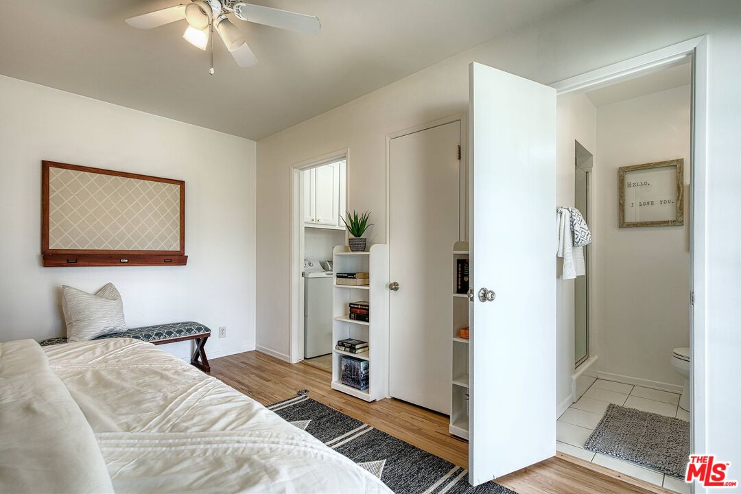 95 Kenneth Street Camarillo, CA 93010 - Photo 12 of 25 a bedroom with a bed and a chandelier