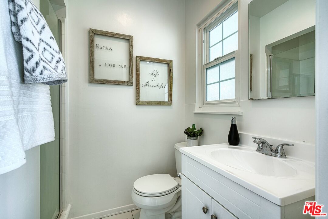 95 Kenneth Street Camarillo, CA 93010 - Photo 13 of 25 a bathroom with a sink toilet and window