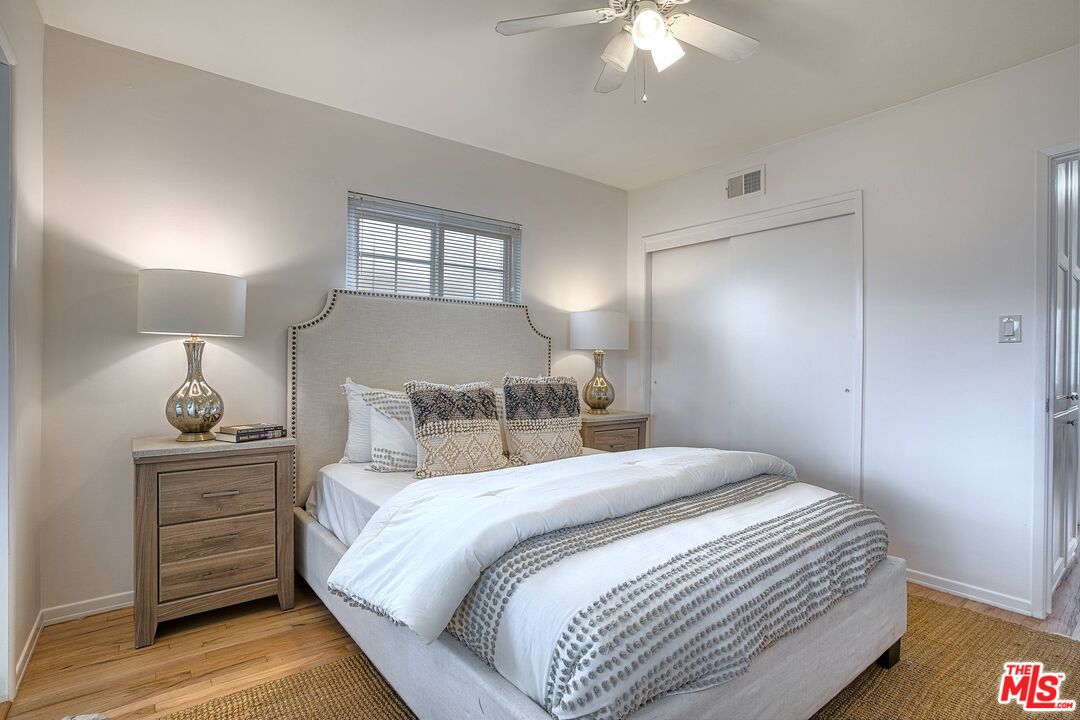 95 Kenneth Street Camarillo, CA 93010 - Photo 15 of 25 a bedroom with a bed and a chandelier