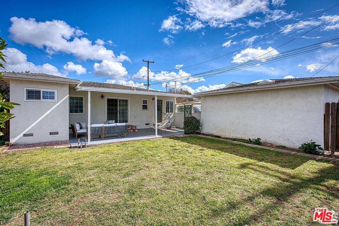 95 Kenneth Street Camarillo, CA 93010 - Photo 21 of 25 a view of a house with a patio and a yard