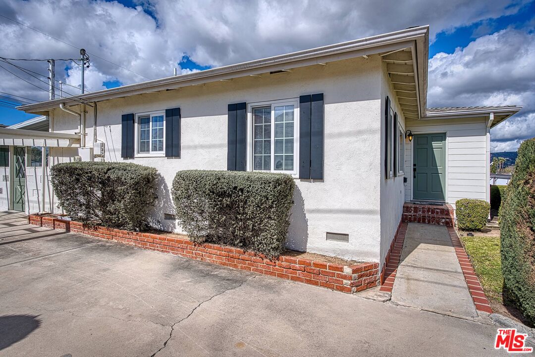 95 Kenneth Street Camarillo, CA 93010 - Photo 3 of 25 a view of a house with a barbeque and wooden stairs