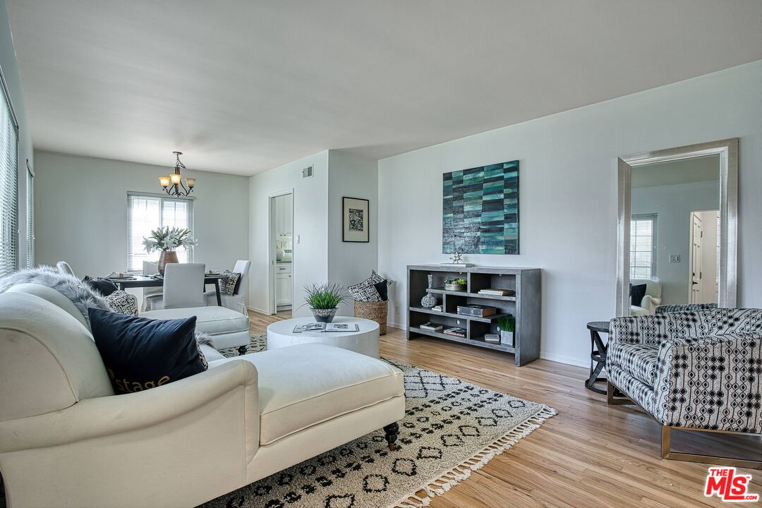 95 Kenneth Street Camarillo, CA 93010 - Photo 4 of 25 a living room with furniture large window and a fireplace