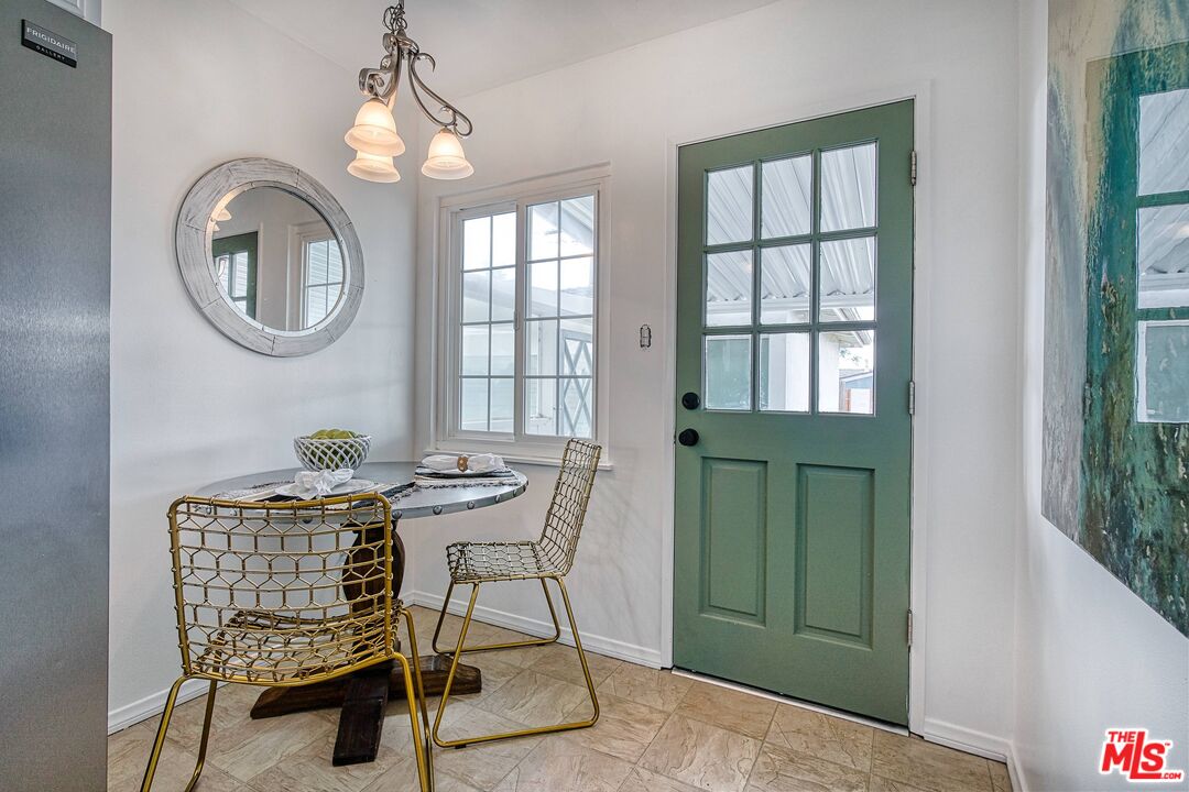 95 Kenneth Street Camarillo, CA 93010 - Photo 8 of 25 a dining room with furniture and a mirror