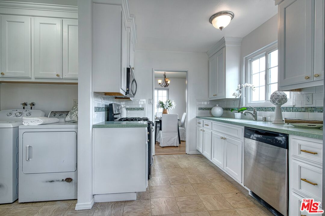 95 Kenneth Street Camarillo, CA 93010 - Photo 9 of 25 a kitchen with granite countertop white cabinets and stainless steel appliances