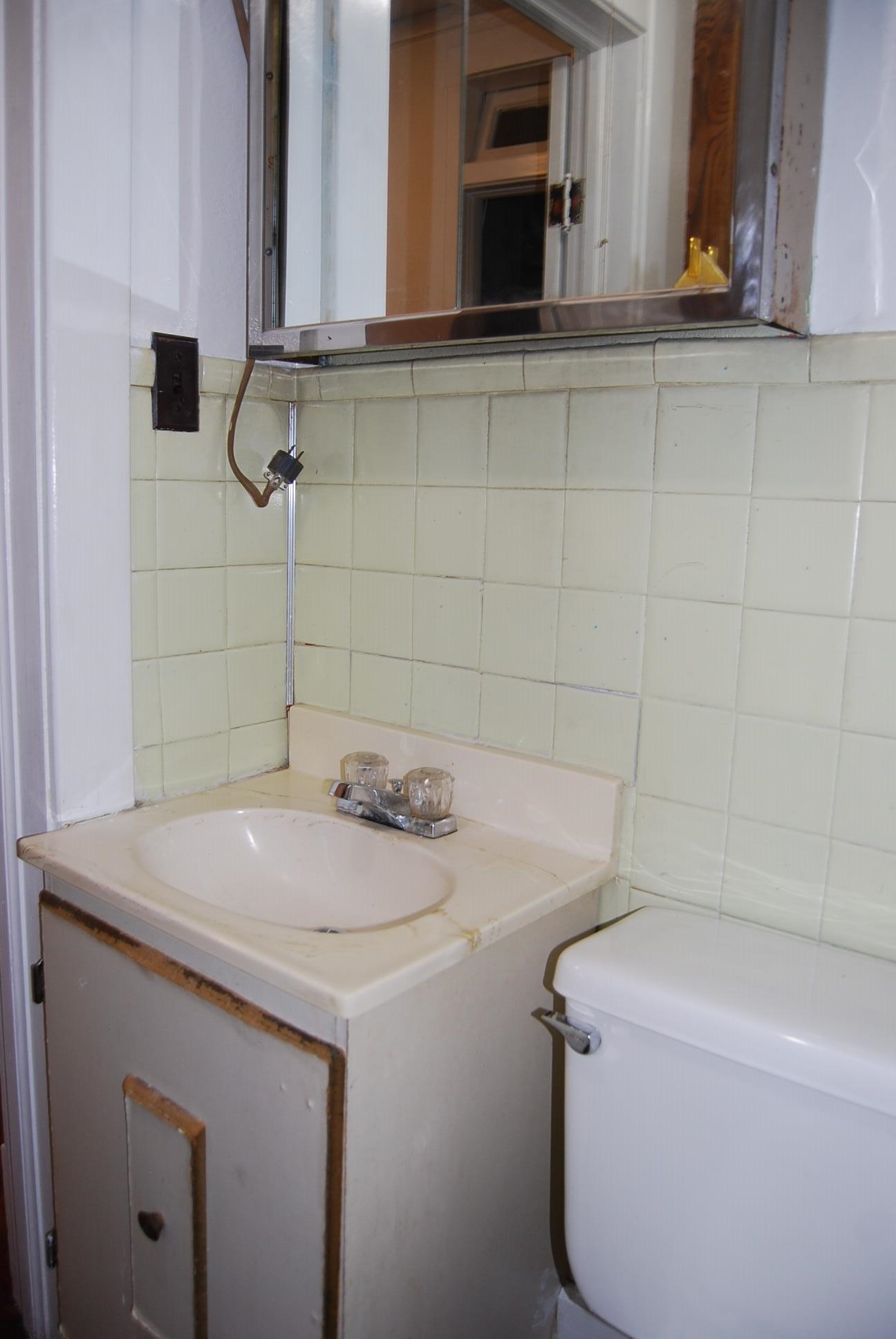 892 Virginia Avenue Goshen, VA 24439 - Photo 13 of 24 a bathroom with a sink and a mirror