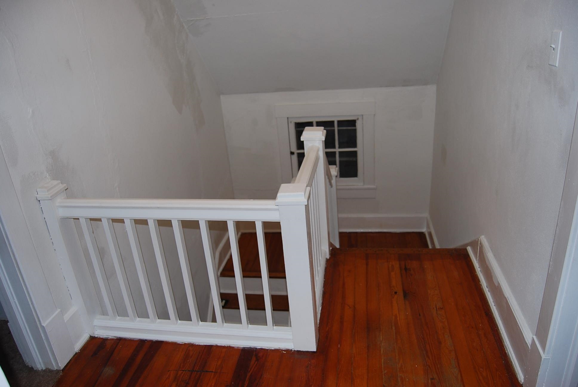892 Virginia Avenue Goshen, VA 24439 - Photo 14 of 24 a view of a hallway with wooden floor and staircase
