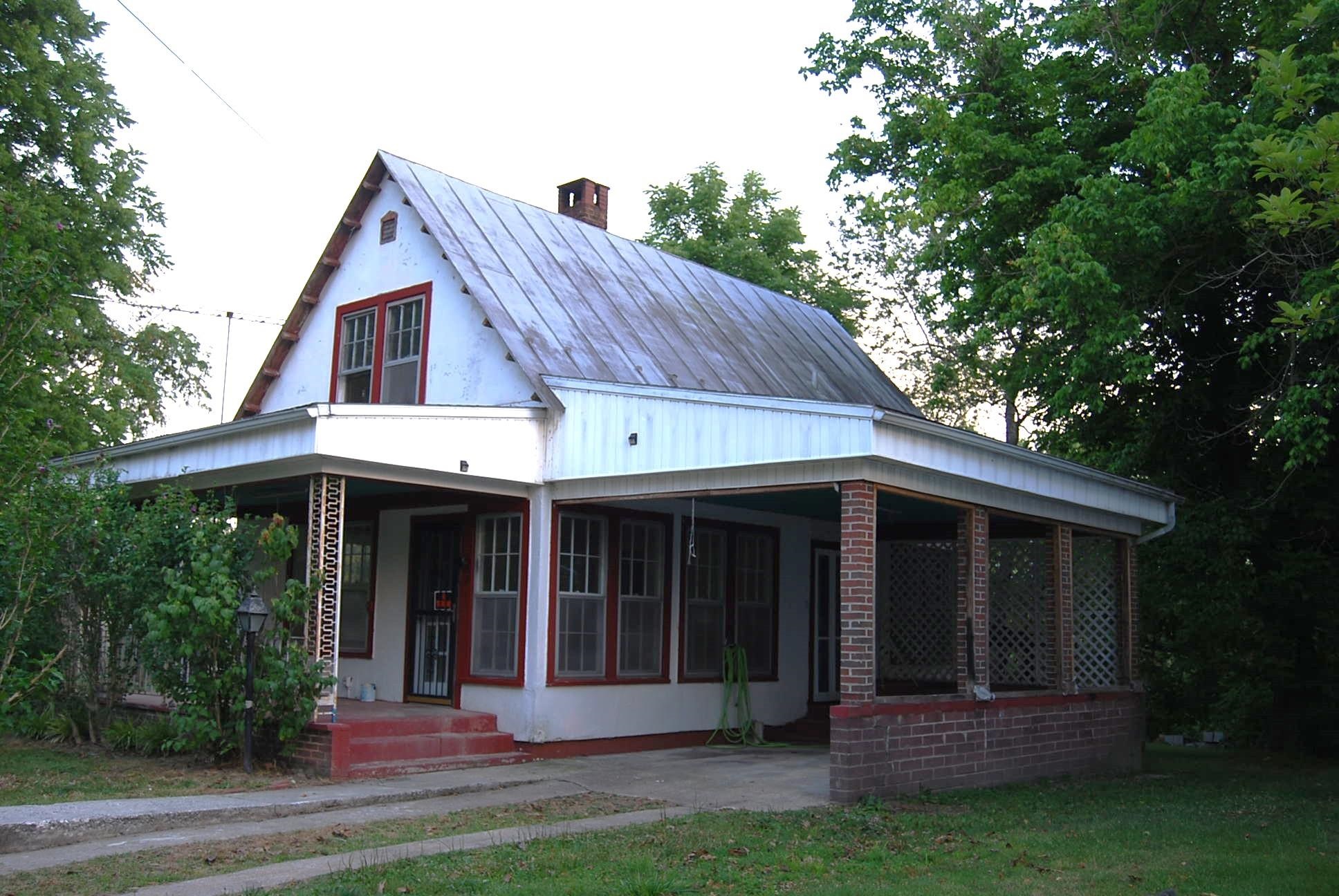 892 Virginia Avenue Goshen, VA 24439 - Photo 2 of 24 a view of a house with a small yard plants and large tree