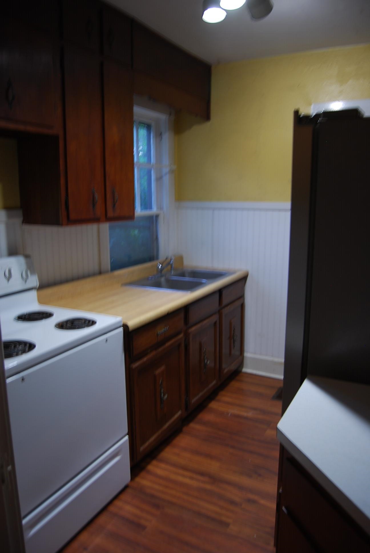 892 Virginia Avenue Goshen, VA 24439 - Photo 6 of 24 a kitchen with a cabinets and wooden floor