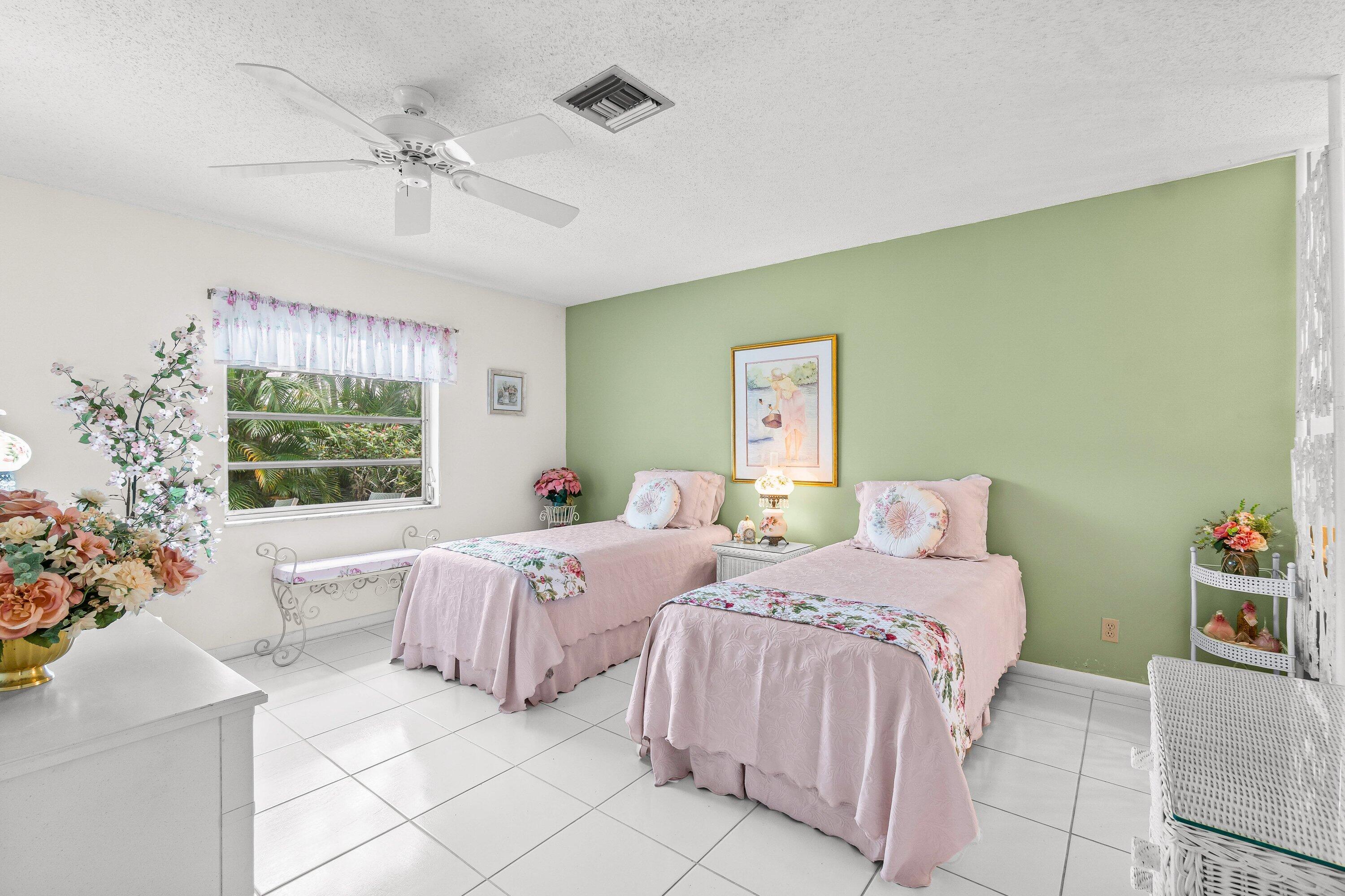 13735 Flora Place, Unit B Delray Beach, FL 33484 - Photo 14 of 28 a bed room with bed and a window