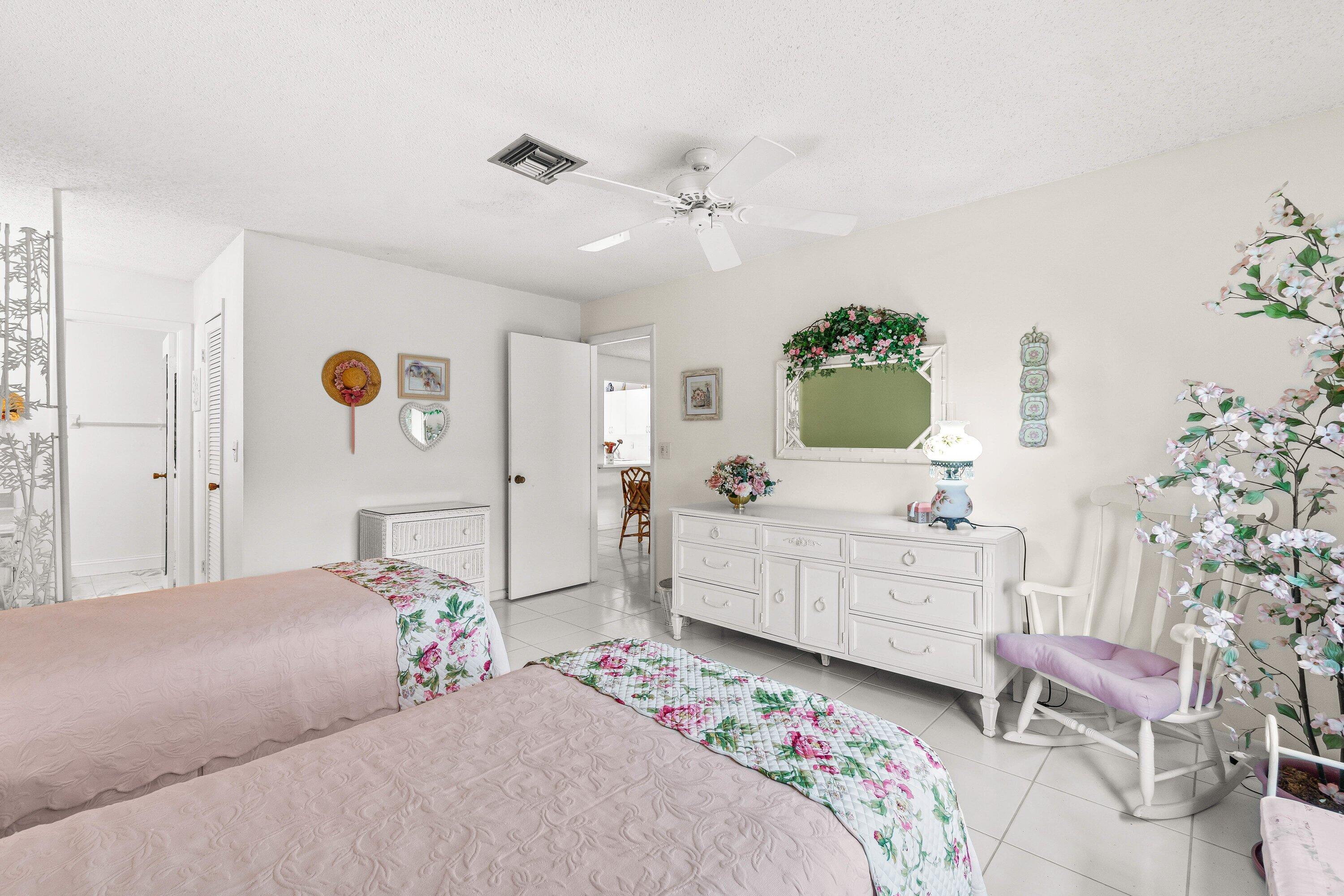 13735 Flora Place, Unit B Delray Beach, FL 33484 - Photo 15 of 28 a bedroom with a bed and a dresser