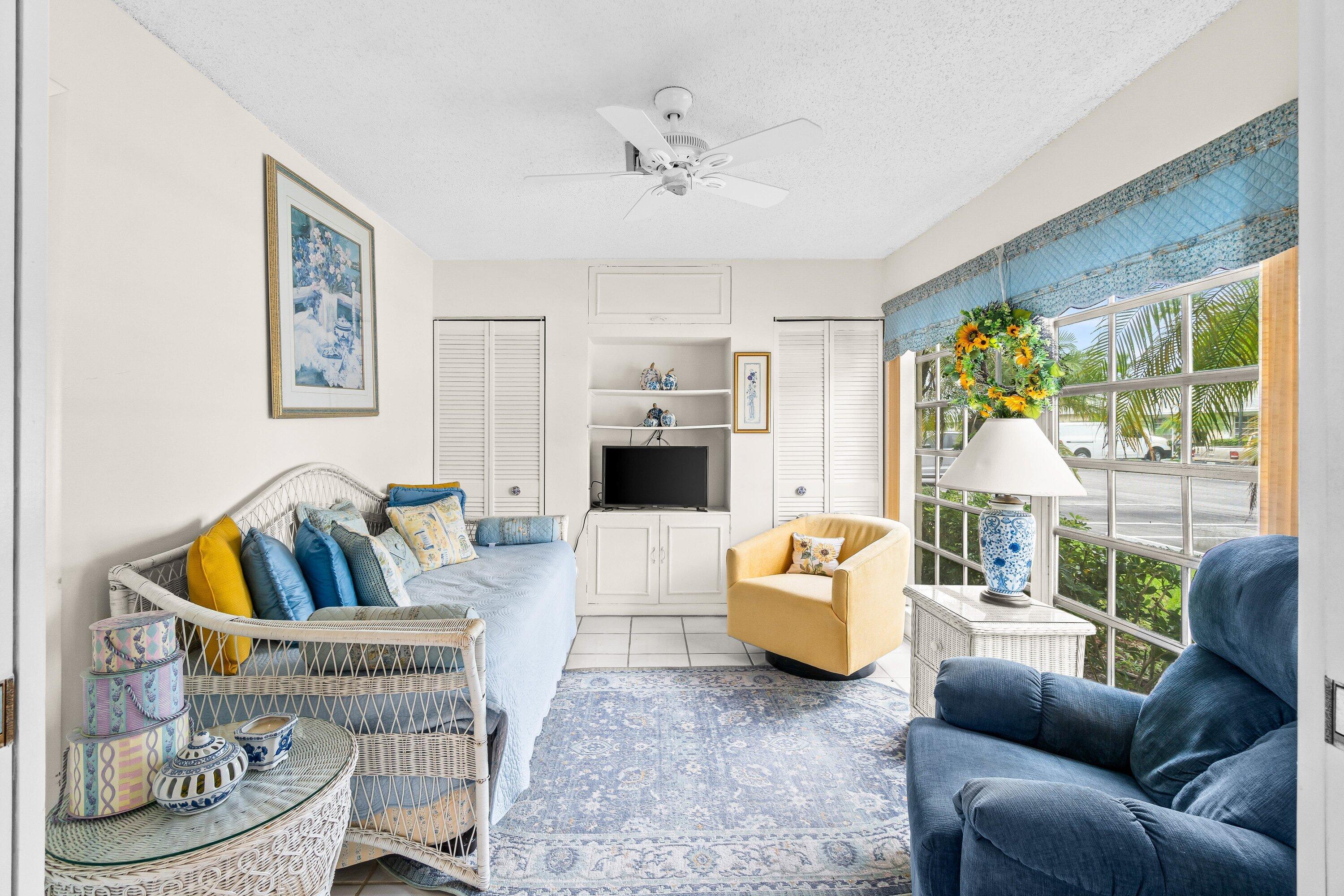13735 Flora Place, Unit B Delray Beach, FL 33484 - Photo 21 of 28 a living room with furniture and a large window
