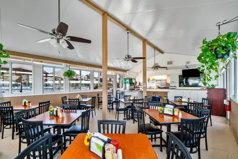 a outdoor dining space with furniture and outdoor view