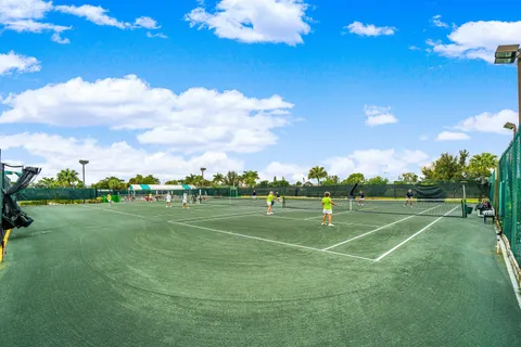 a view of a basket ball ground and trees