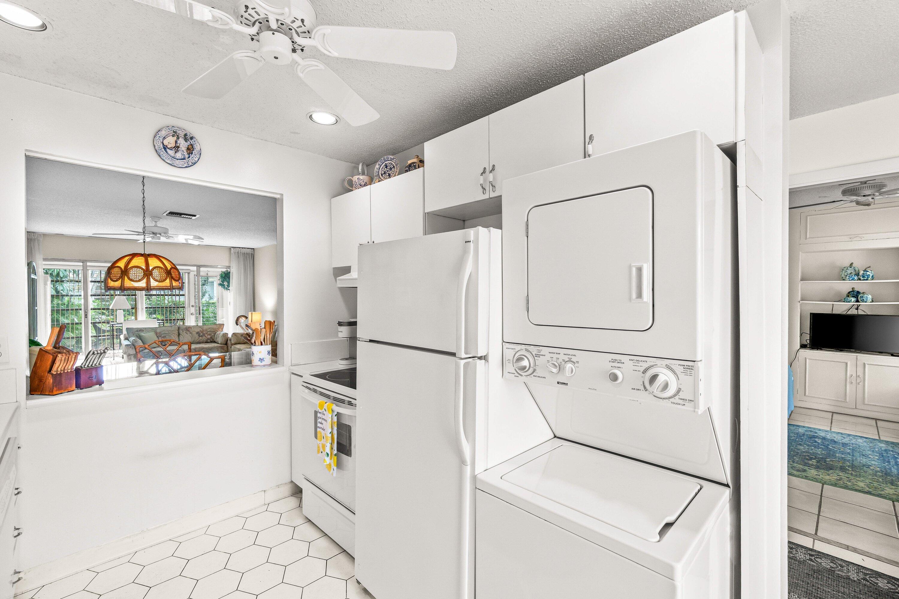 13735 Flora Place, Unit B Delray Beach, FL 33484 - Photo 4 of 28 a white refrigerator freezer sitting in a kitchen