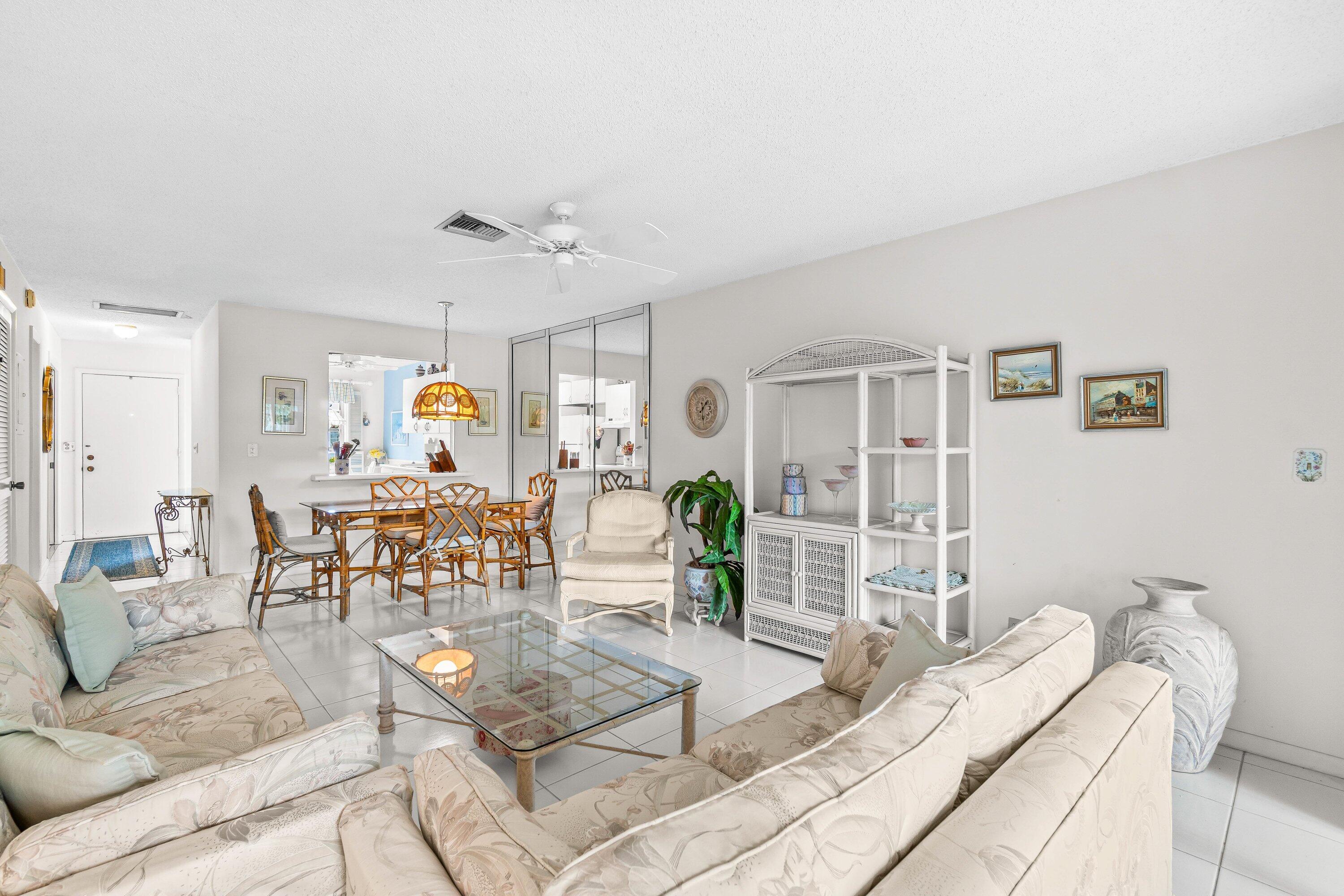 13735 Flora Place, Unit B Delray Beach, FL 33484 - Photo 9 of 28 a living room with furniture and wooden floor
