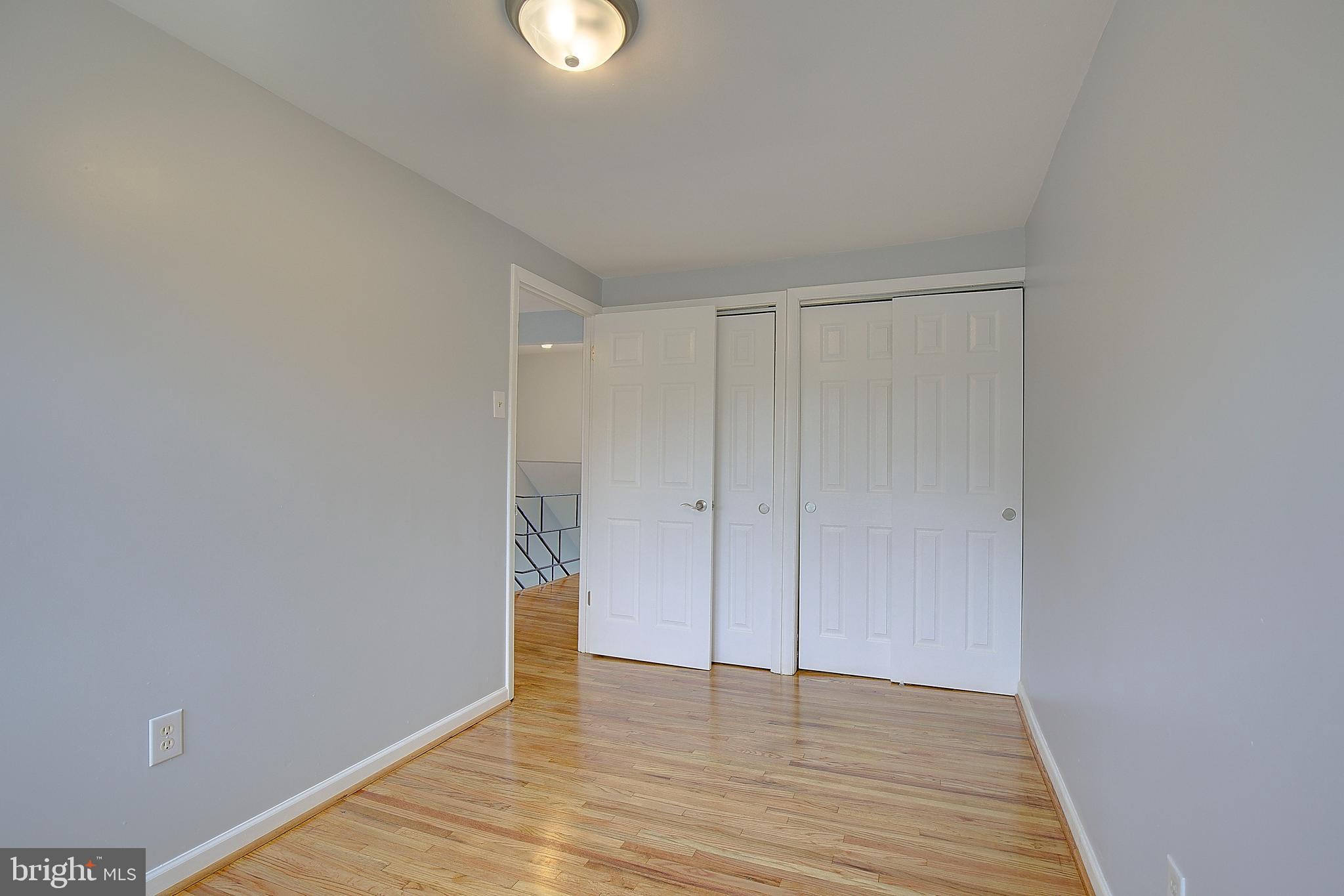 4330 Annapolis Road Baltimore, MD 21227 - Photo 19 of 34 a view of an empty room and wooden floor