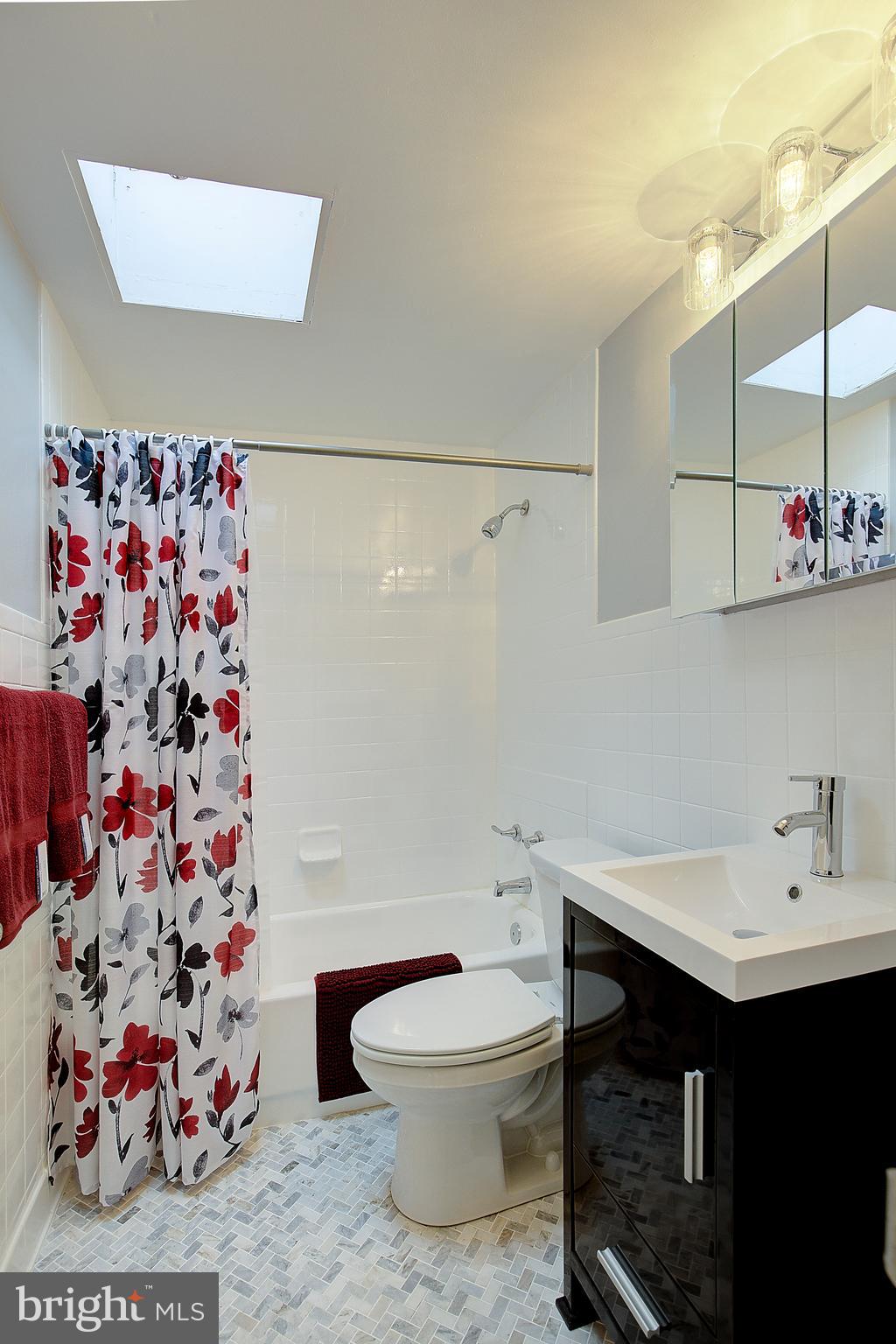 4330 Annapolis Road Baltimore, MD 21227 - Photo 26 of 34 a bathroom with a sink toilet and shower