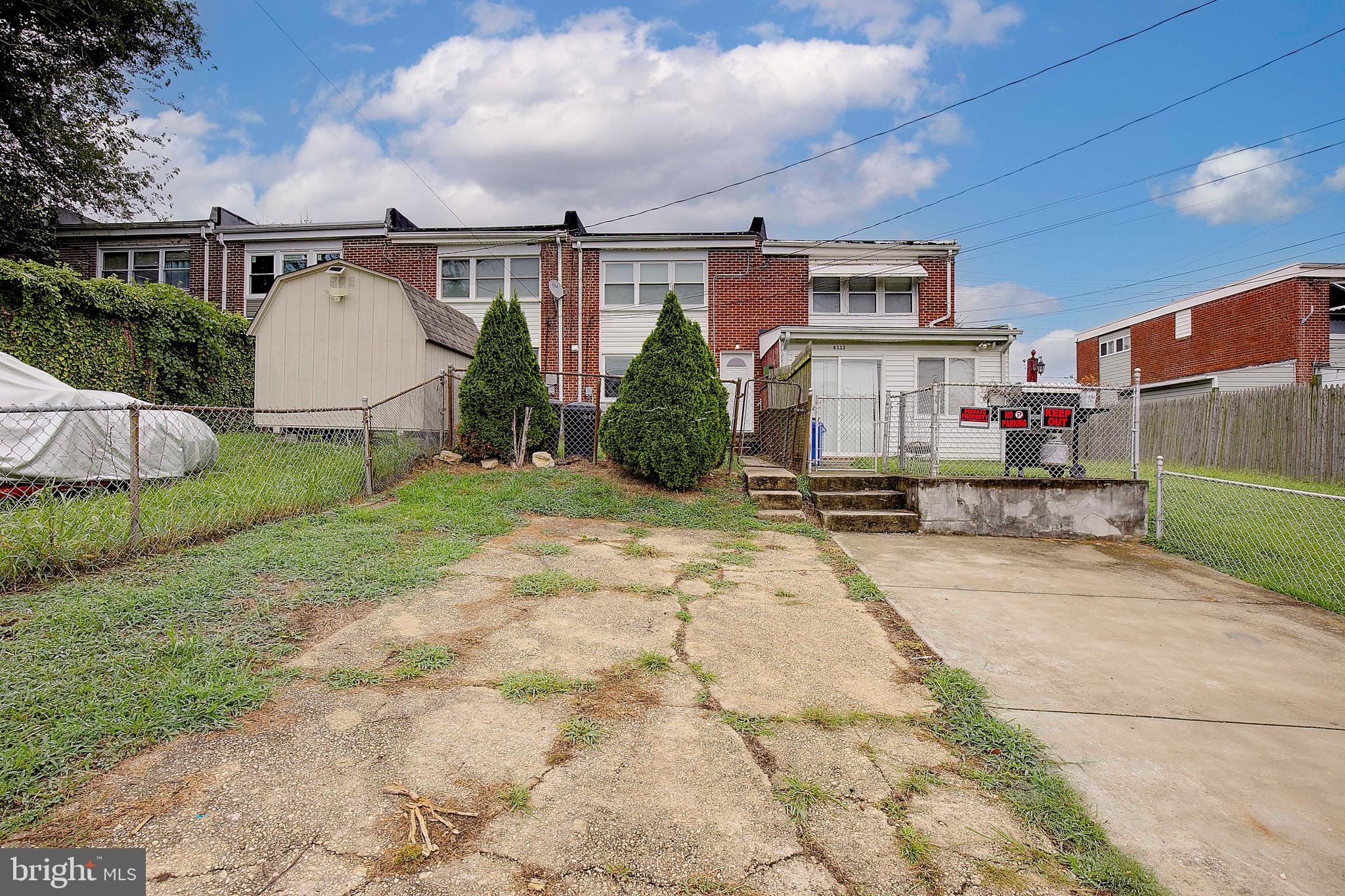 4330 Annapolis Road Baltimore, MD 21227 - Photo 34 of 34 a front view of a house with a yard and garage