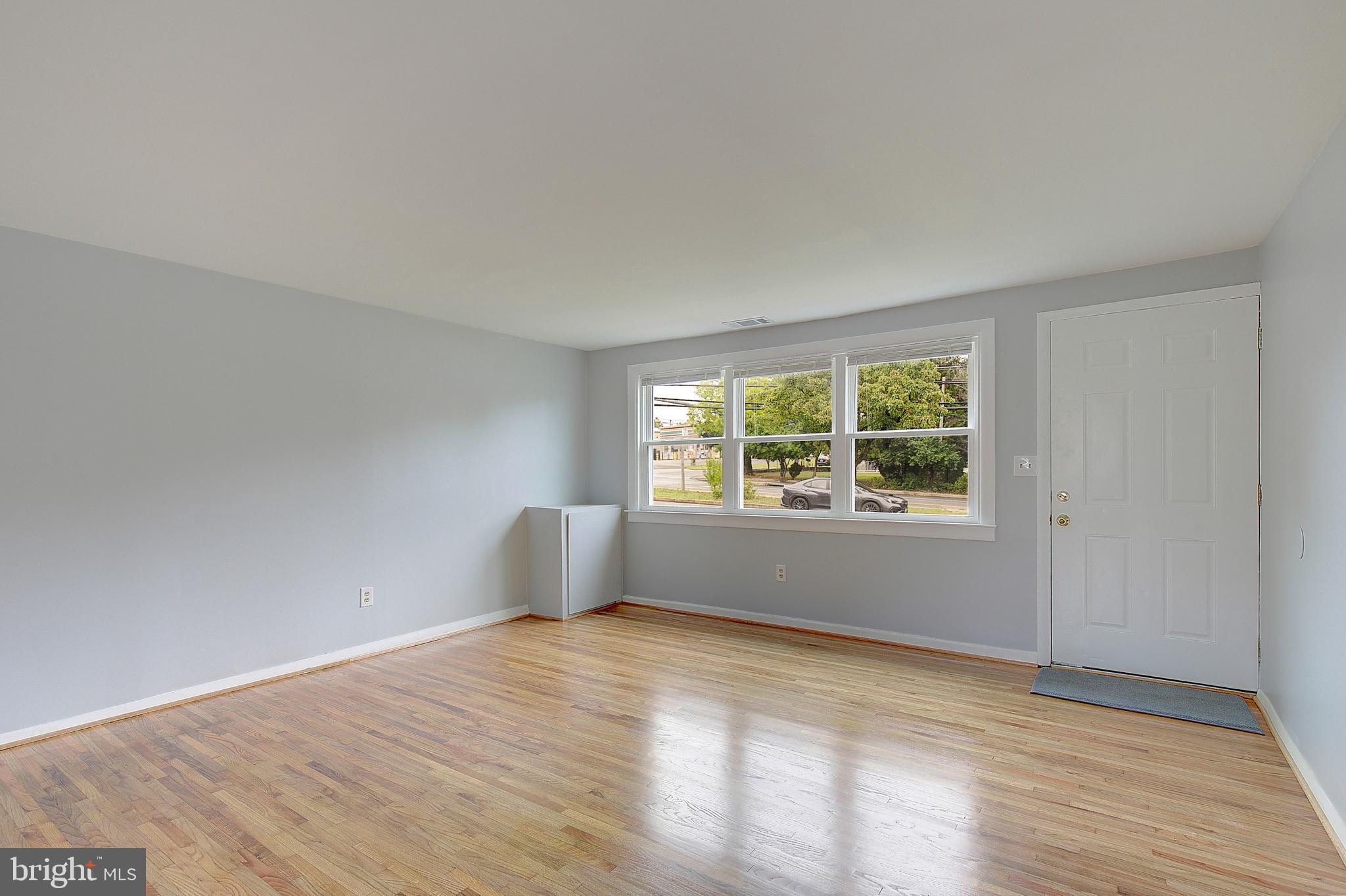 4330 Annapolis Road Baltimore, MD 21227 - Photo 5 of 34 a view of empty room with wooden floor and fan