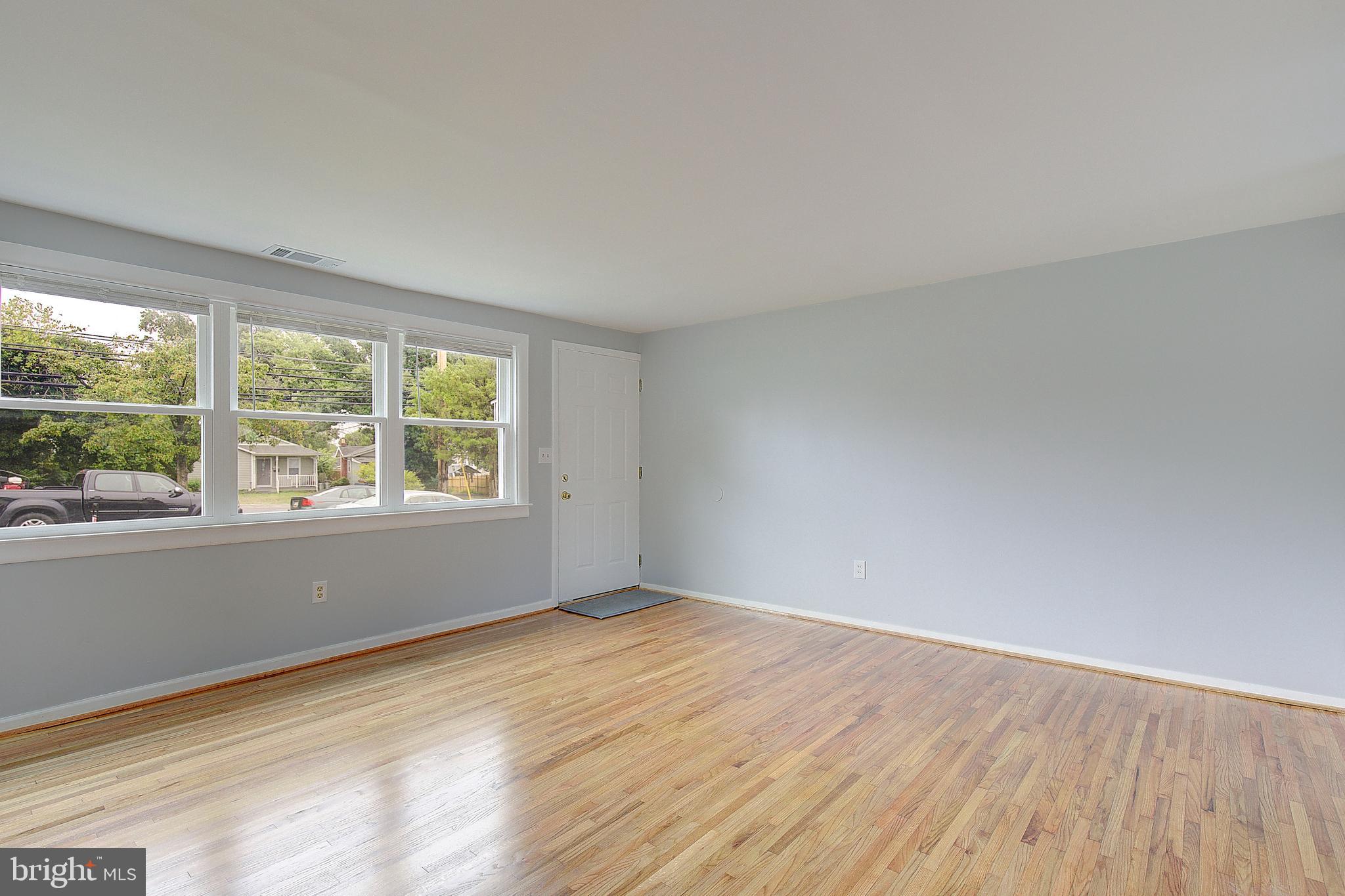 4330 Annapolis Road Baltimore, MD 21227 - Photo 8 of 34 wooden floor in an empty room with a window