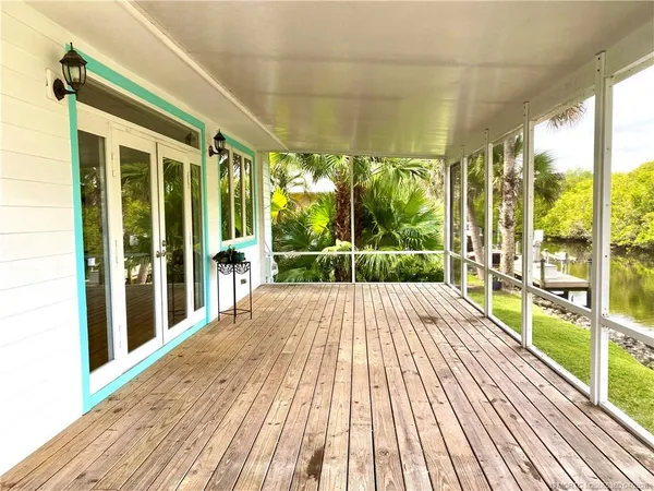 a view of a balcony with wooden floor
