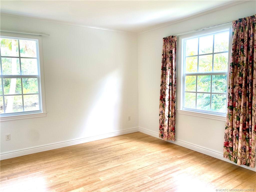 625 Southwest Salerno Road Stuart, FL 34997 - Photo 10 of 21 an empty room with windows