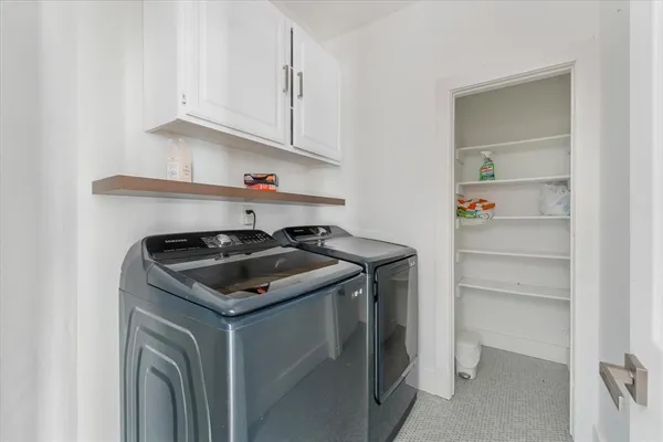 a white stove top oven sitting inside of a kitchen