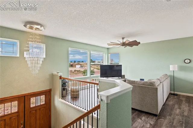 a view of a livingroom with furniture and windows