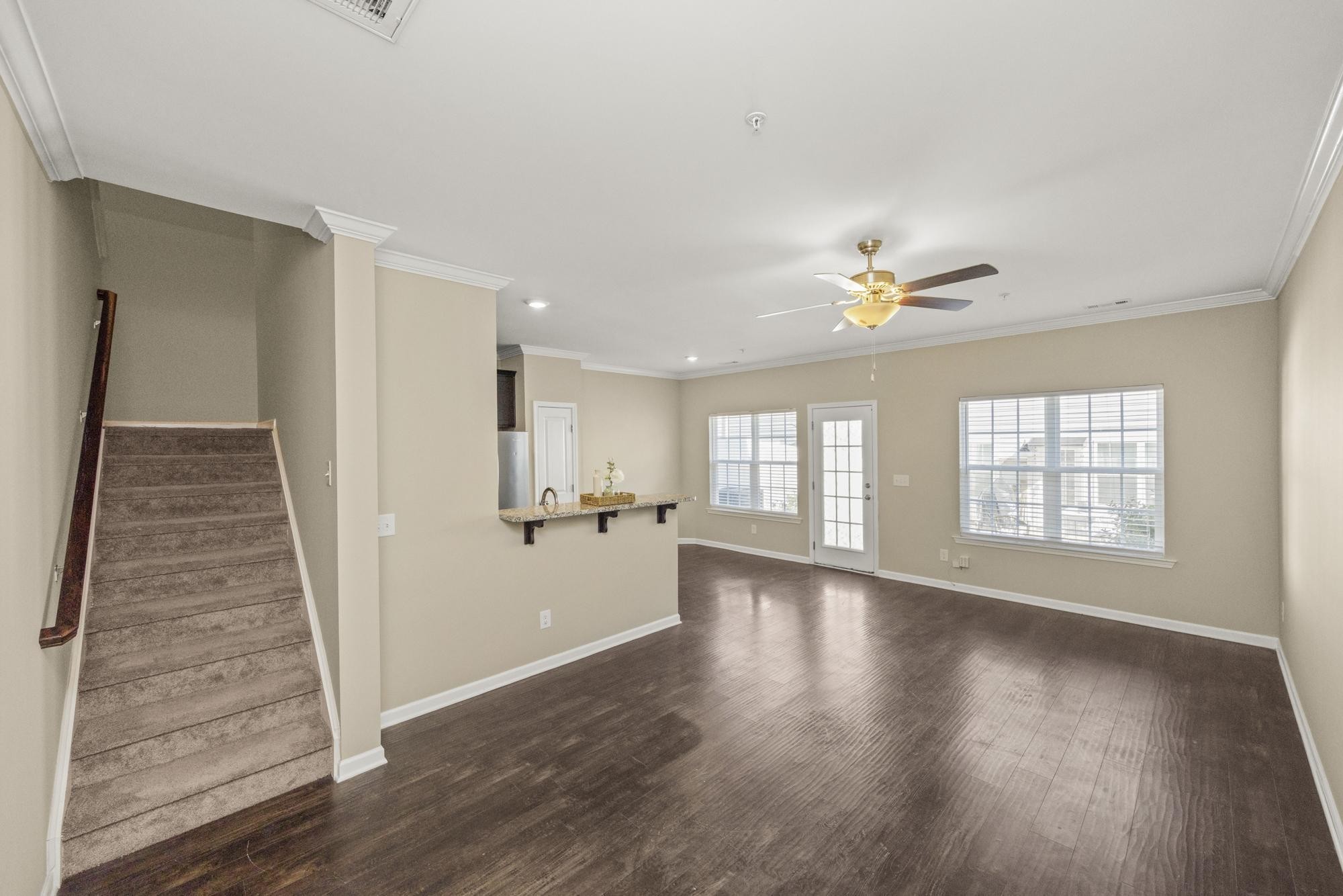 112 Bergen Drive Spring Hill, TN 37174 - Photo 12 of 37 a view of an empty room with wooden floor and a window