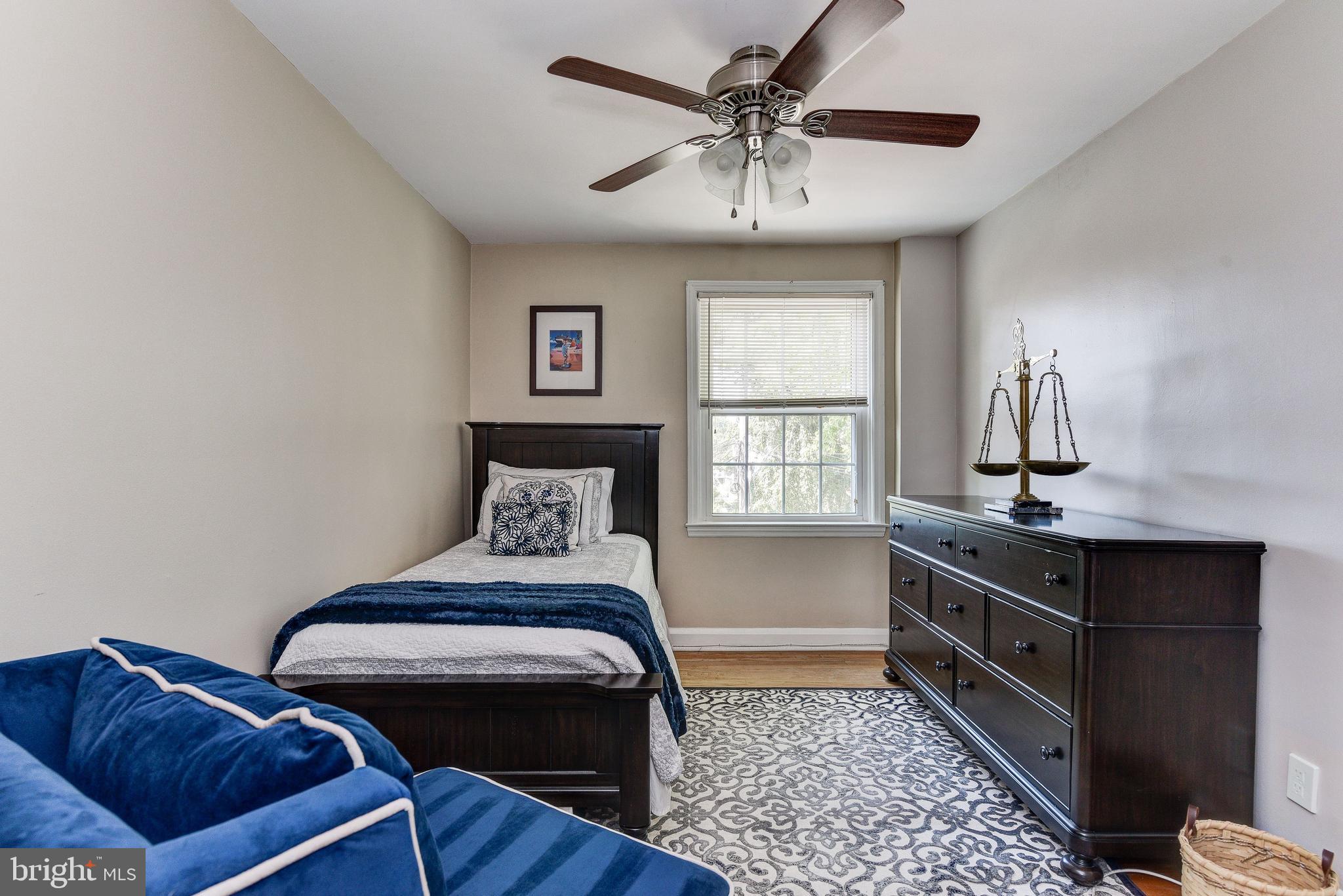 506 Academy Road Baltimore, MD 21228 - Photo 29 of 49 a bedroom with furniture and window