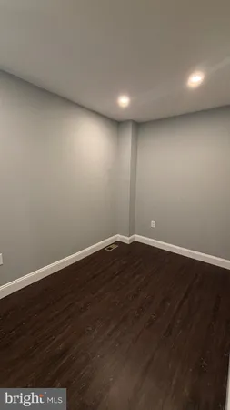 a view of room with wooden floor