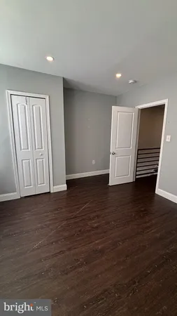 a view of room with wooden floor