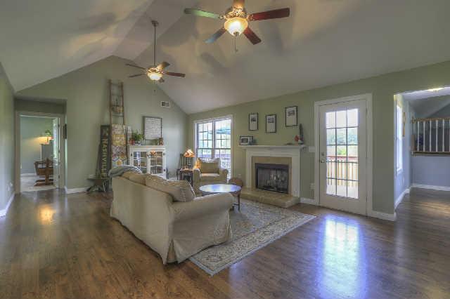 204 Contrary Road Burns, TN 37029 - Photo 8 of 20 Den with beautiful hardwood, gas fireplace and vaulted ceilings with double fans