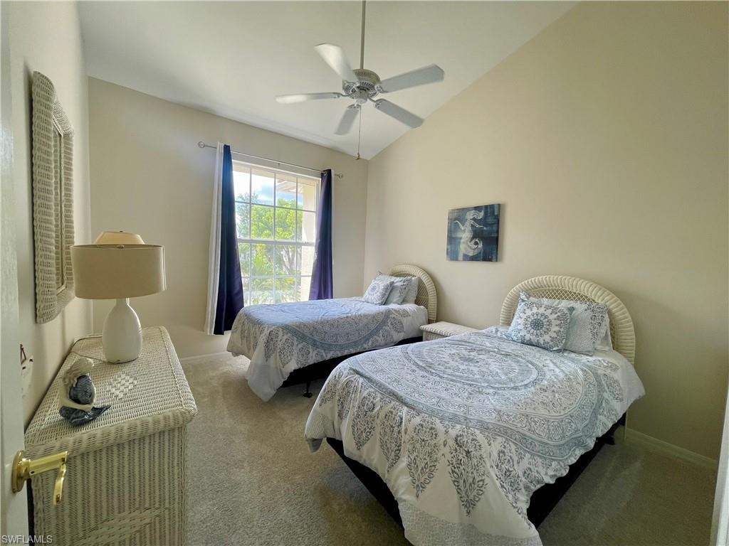 317 Sunrise Cay, Unit 204 Naples, FL 34114 - Photo 11 of 19 a bedroom with two beds and windows
