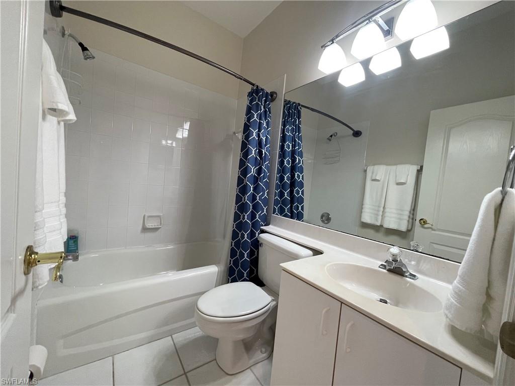 317 Sunrise Cay, Unit 204 Naples, FL 34114 - Photo 15 of 19 a bathroom with a sink a toilet and shower