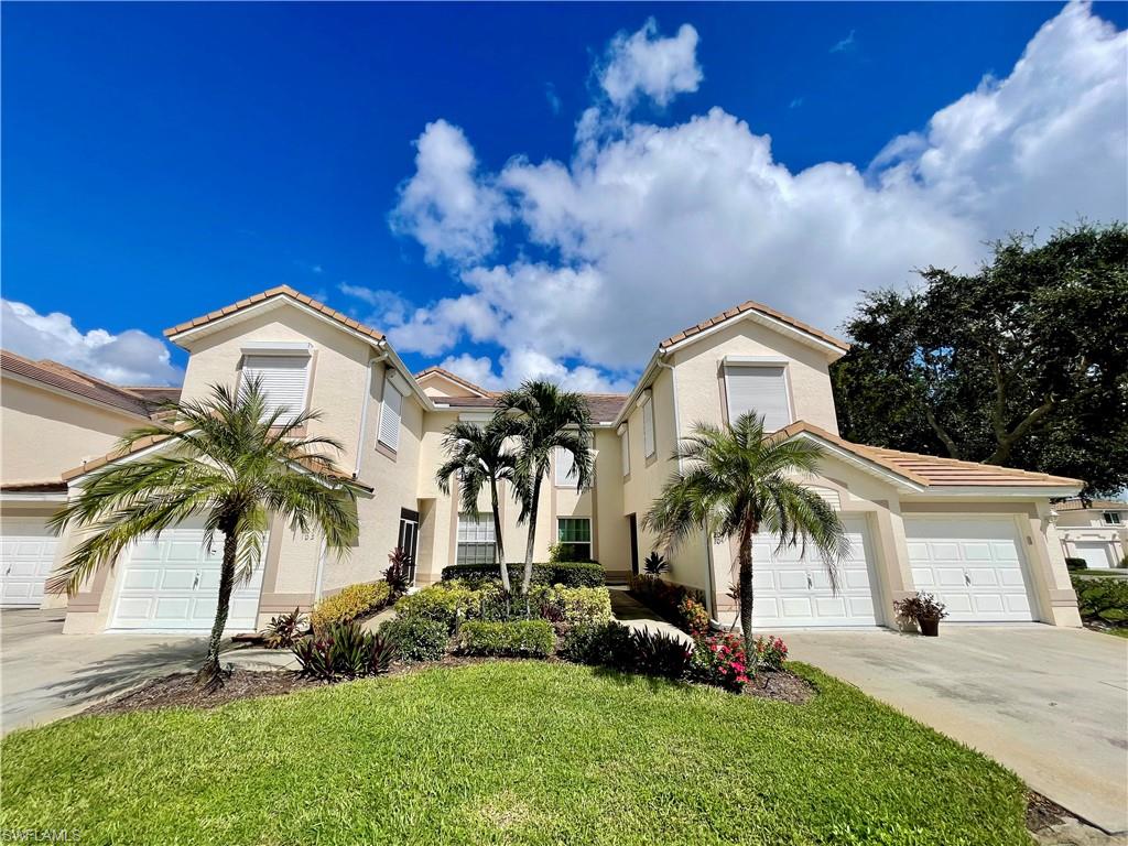 317 Sunrise Cay, Unit 204 Naples, FL 34114 - Photo 3 of 19 a view of a house with a yard and potted plants