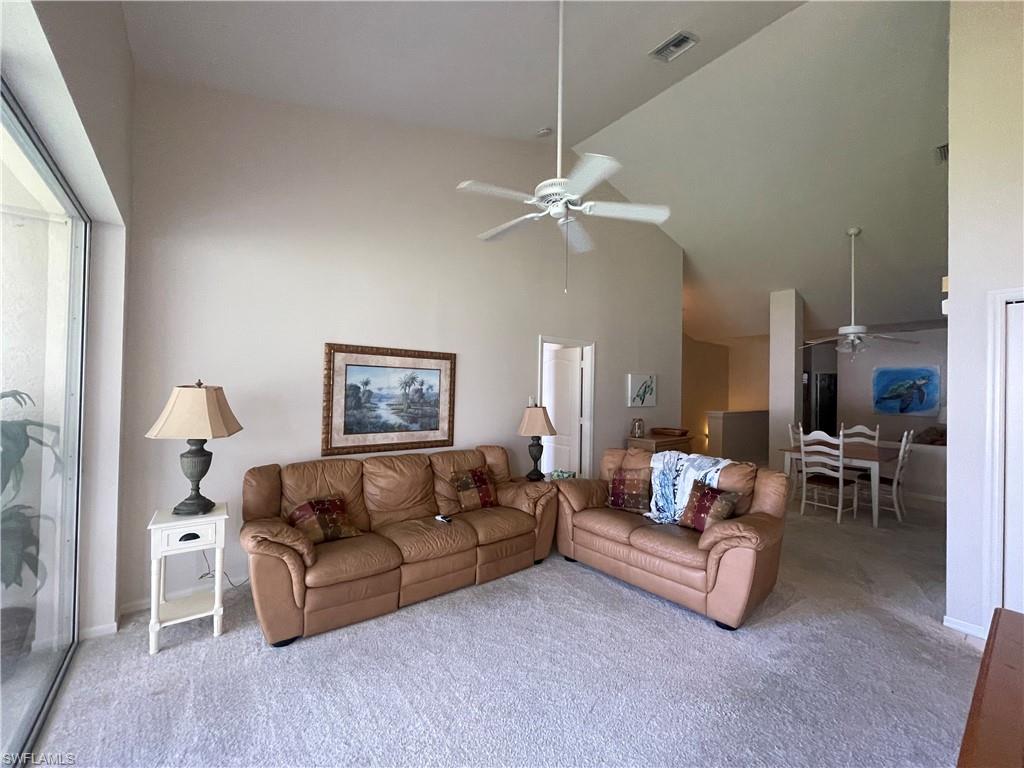 317 Sunrise Cay, Unit 204 Naples, FL 34114 - Photo 8 of 19 a living room with furniture