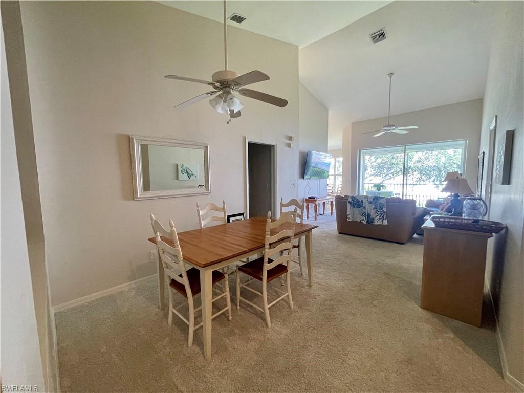 317 Sunrise Cay, Unit 204 Naples, FL 34114 - Photo 9 of 19 a view of a livingroom with furniture and a window