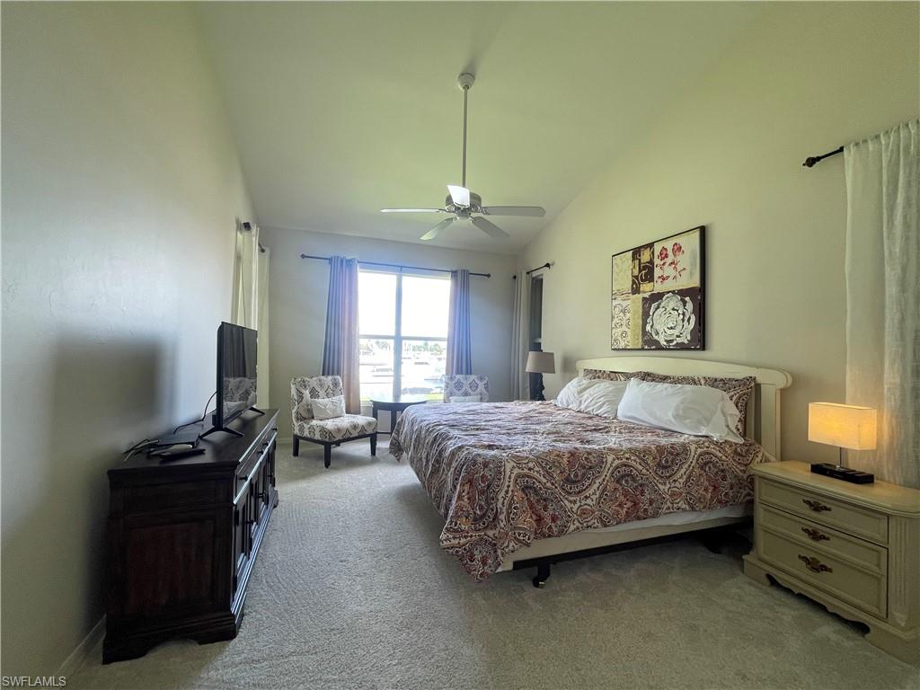 317 Sunrise Cay, Unit 204 Naples, FL 34114 - Photo 10 of 19 a bedroom with bed and window