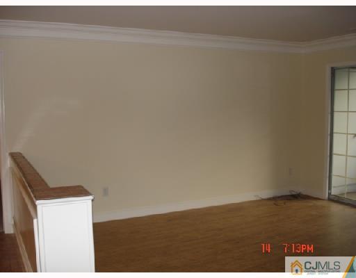 304 Raintree Court Helmetta, NJ 08828 - Photo 4 of 8 a view of wooden floor