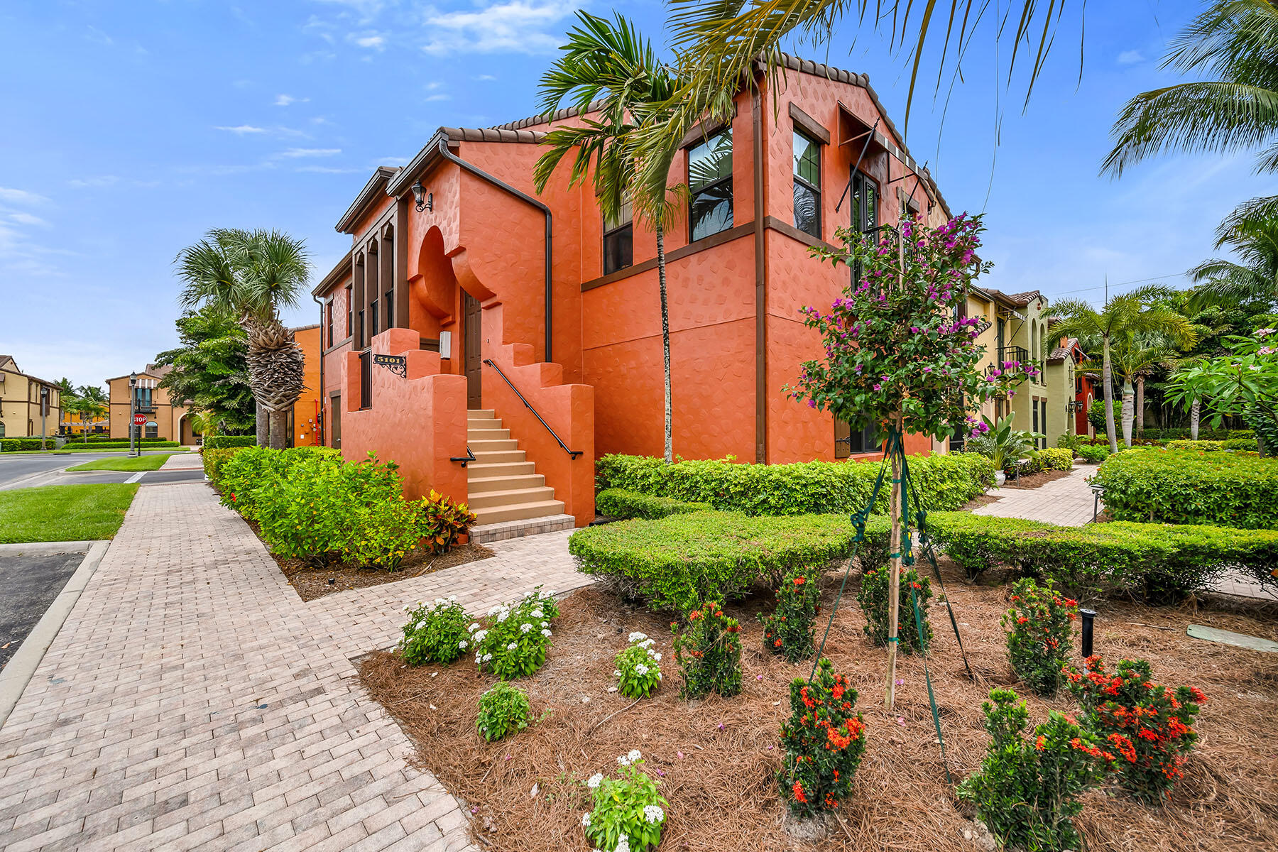9066 Albion Lane North, Unit 5101 Naples, FL 34113 - Photo 42 of 48 a front view of a house with garden