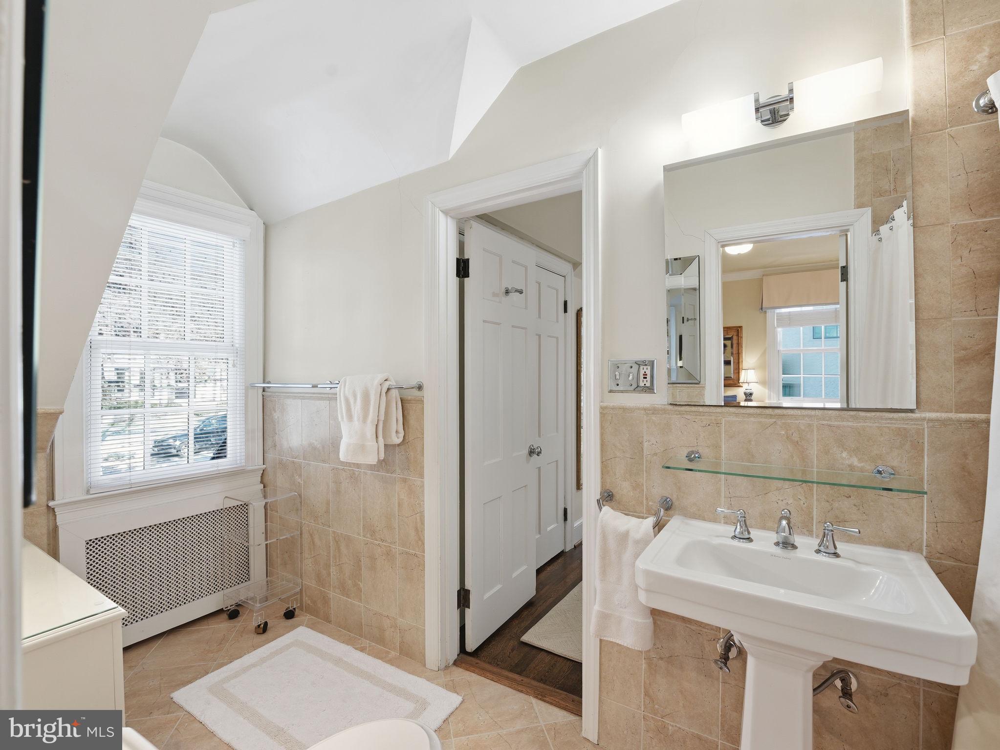 4944 Quebec Street Northwest Washington, DC 20016 - Photo 24 of 41 Primary bathroom provides a relaxing setting.